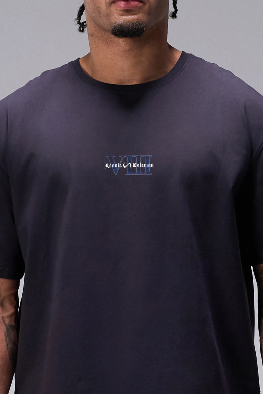 Black Ronnie Coleman “champ” Tee showing premium Cotton Luxe DNA™ fabric texture and Ronnie Coleman x TLF graphic detail by TLF Apparel – FRONT detail view