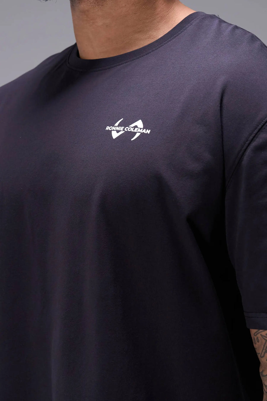 Black Ronnie Coleman “discipline” Tee showing premium Cotton Luxe DNA™ fabric texture and Ronnie Coleman x TLF graphic detail by TLF Apparel – FRONT detail view