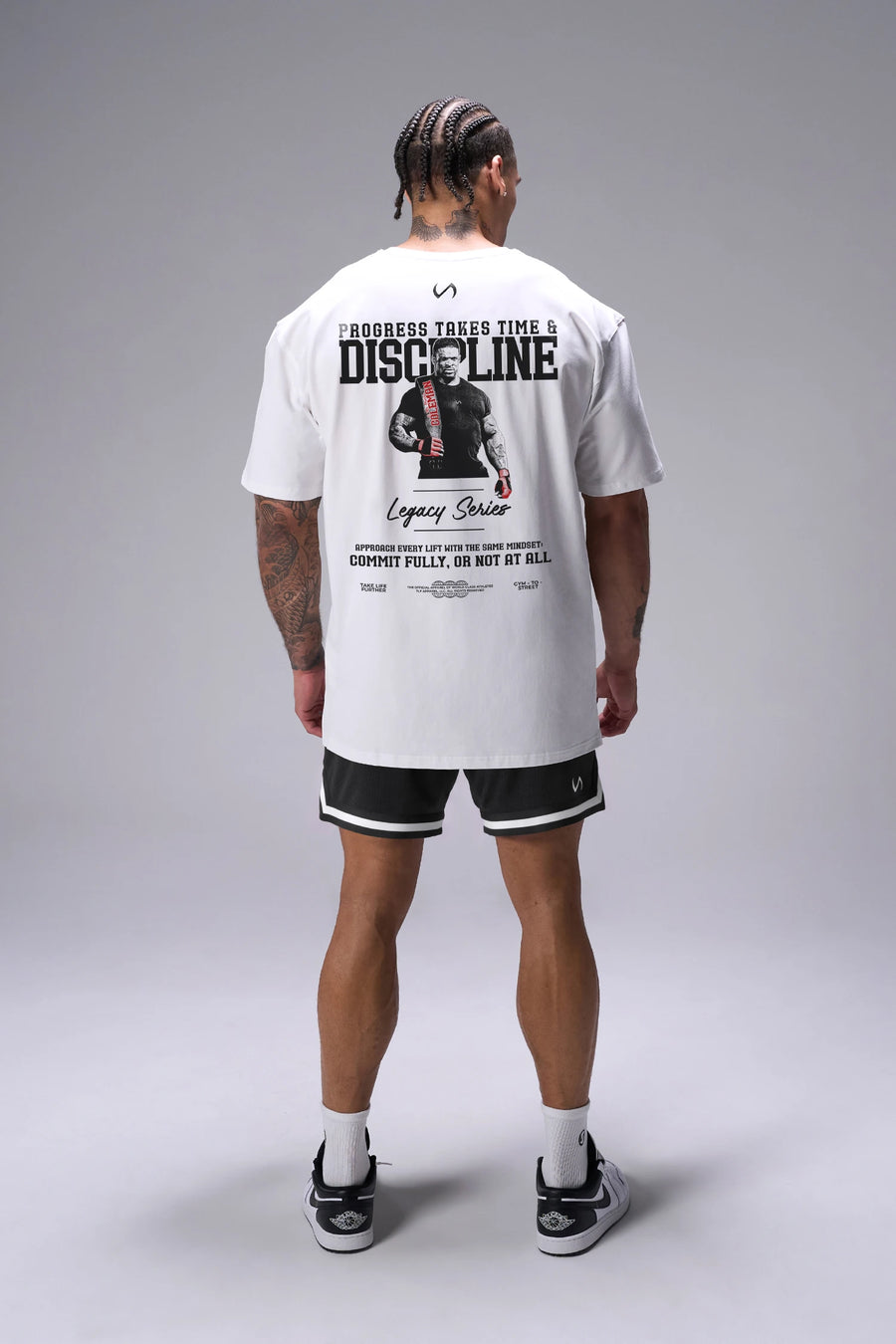 White Ronnie Coleman “discipline” Tee oversized bodybuilding graphic shirt featuring iconic Ronnie Coleman legacy artwork by TLF Apparel – back view