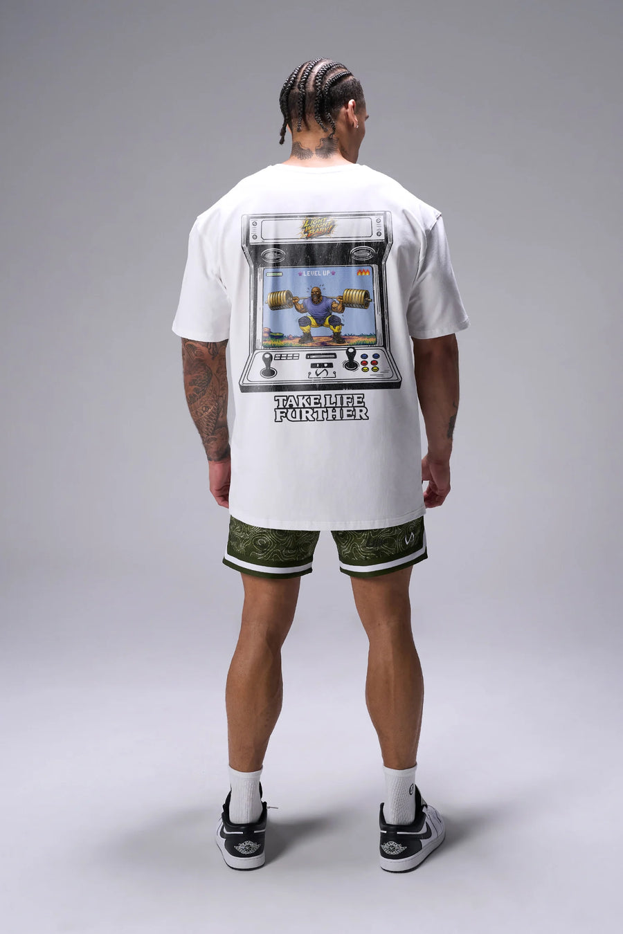 White Ronnie Coleman “Level Up” Tee oversized bodybuilding graphic shirt featuring iconic Ronnie Coleman legacy artwork by TLF Apparel – back view
