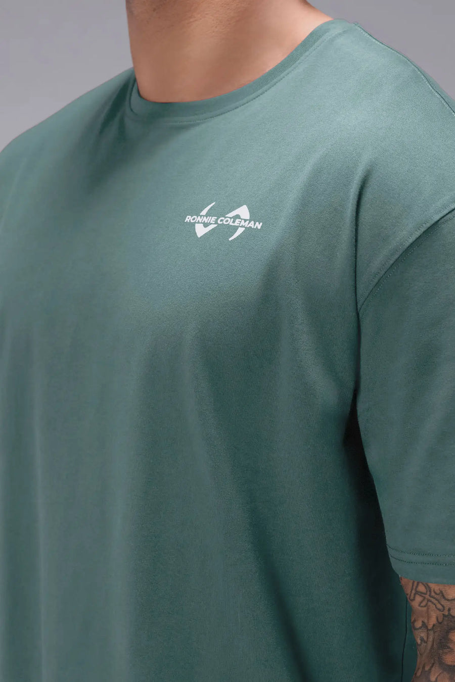 Dark Forest Ronnie Coleman “Light Weight Baby” Tee showing premium Cotton Luxe DNA™ fabric texture and Ronnie Coleman x TLF graphic detail by TLF Apparel – FRONT detail view