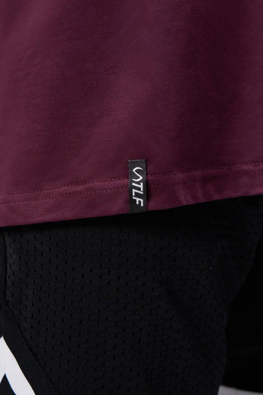 Maroon Ronnie Coleman “Light Weight Baby” Tee showing premium Cotton Luxe DNA™ fabric texture and Ronnie Coleman x TLF graphic detail by TLF Apparel – detail view