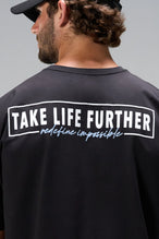 Black Statement Cotton Luxe Oversized Tee with statement Take Life Further upper back graphic by TLF Apparel – back view