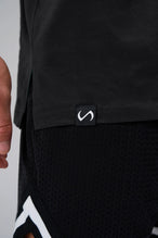 Black Statement Cotton Luxe Oversized Tee showing side split hem, woven hem clip label, and Cotton Luxe DNA fabric by TLF Apparel – detail view 