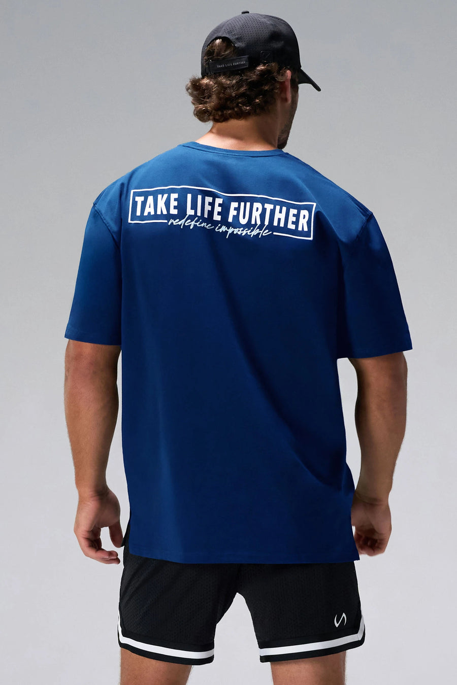 Blue Statement Cotton Luxe Oversized Tee showing Take Life Further back graphic and oversized fit by TLF Apparel – back view