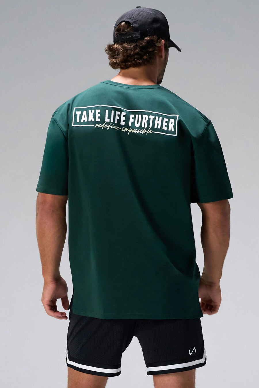 Green Statement Cotton Luxe Oversized Tee showing Take Life Further back graphic and oversized fit by TLF Apparel – back view