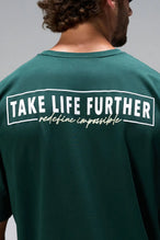 Green Statement Cotton Luxe Oversized Tee with statement Take Life Further upper back graphic by TLF Apparel – back view 