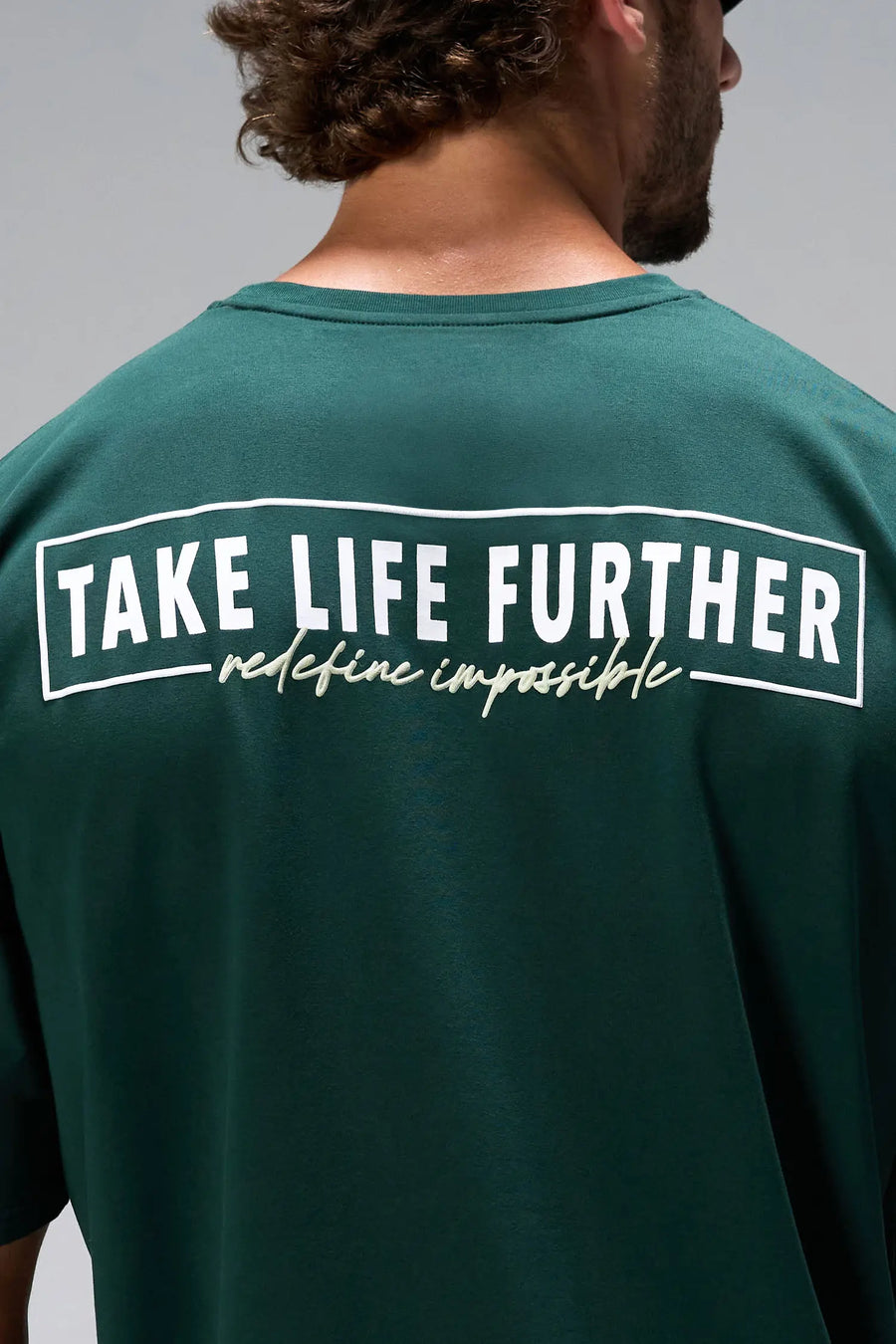 Green Statement Cotton Luxe Oversized Tee with statement Take Life Further upper back graphic by TLF Apparel – back view 