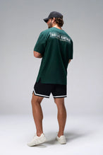 Green Statement Cotton Luxe Oversized Tee showing relaxed oversized fit in 93% cotton 7% elastane by TLF Apparel – side view