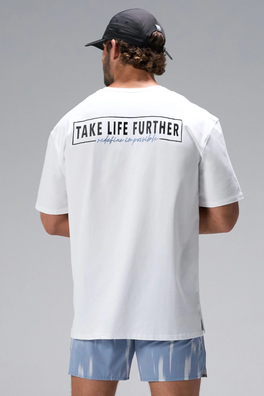White Statement Cotton Luxe Oversized Tee showing Take Life Further back graphic and oversized fit by TLF Apparel – back view
