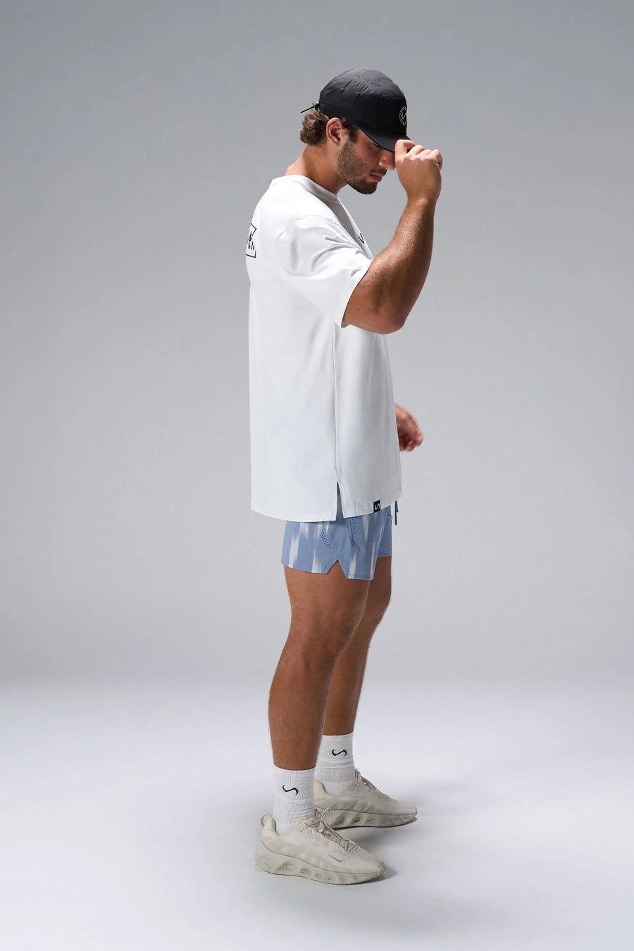 White Statement Cotton Luxe Oversized Tee showing oversized drape and gym-to-street fit by TLF Apparel – side view