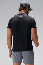 Black Pluma Sun Tee showing upper back logo and breathable Pluma Tech DNA fabric by TLF Apparel – back view