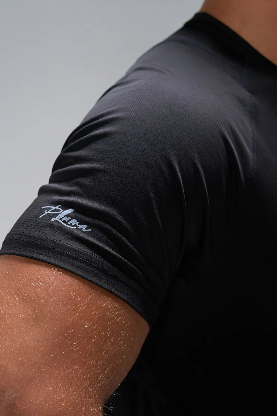 Black Pluma Sun Tee showing raglan sleeves, athletic fit, and quick-drying fabric by TLF Apparel – side view