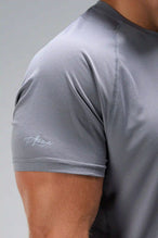 Quiet Shade Pluma Sun Tee showing UV color-changing arm logo and micro-grid knit fabric by TLF Apparel – detail view