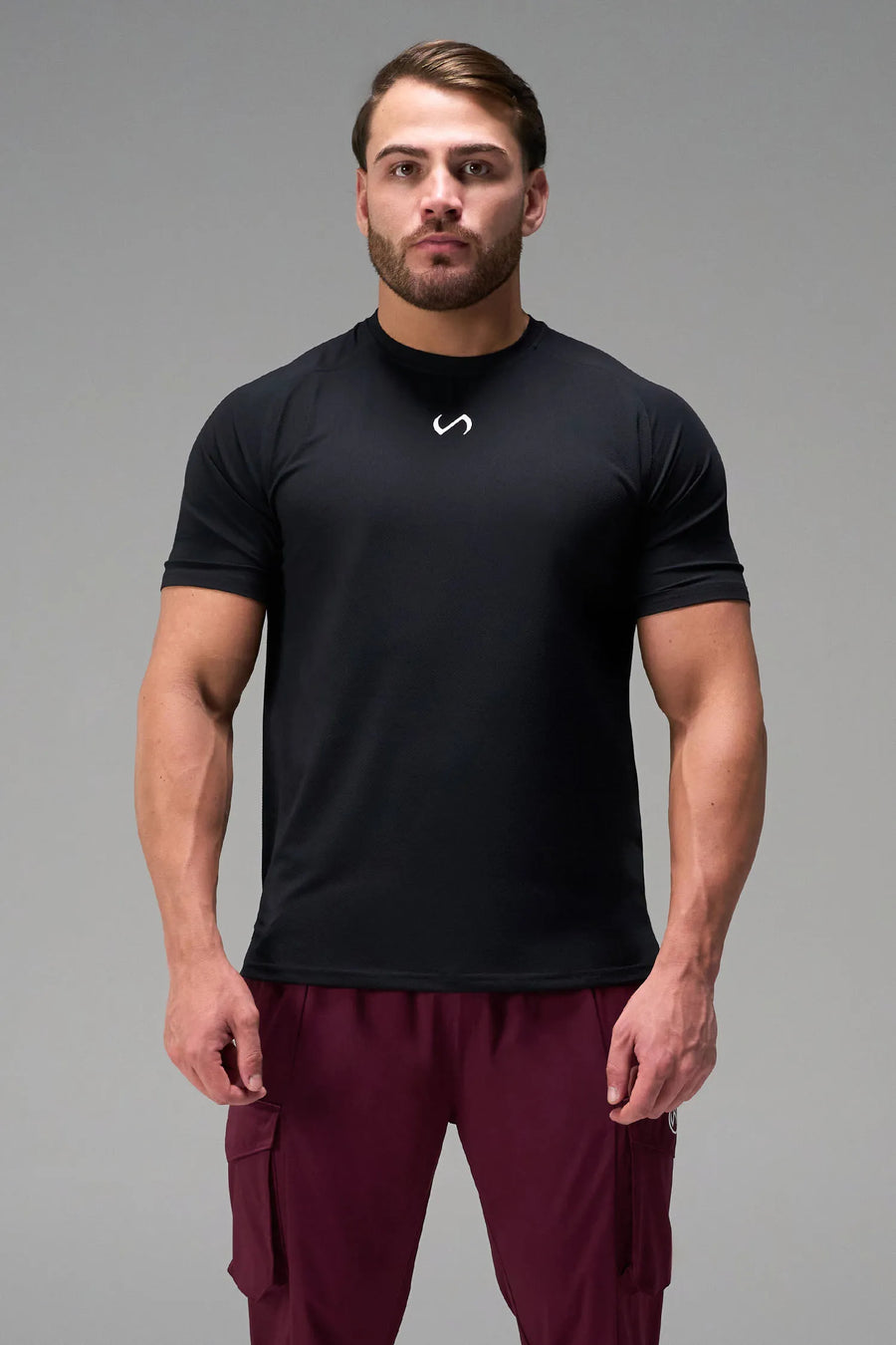 Black Men’s Micro Mesh Tee with a physique-enhancing fit, designed for gym training, HIIT workouts and running by TLF Apparel – front view 