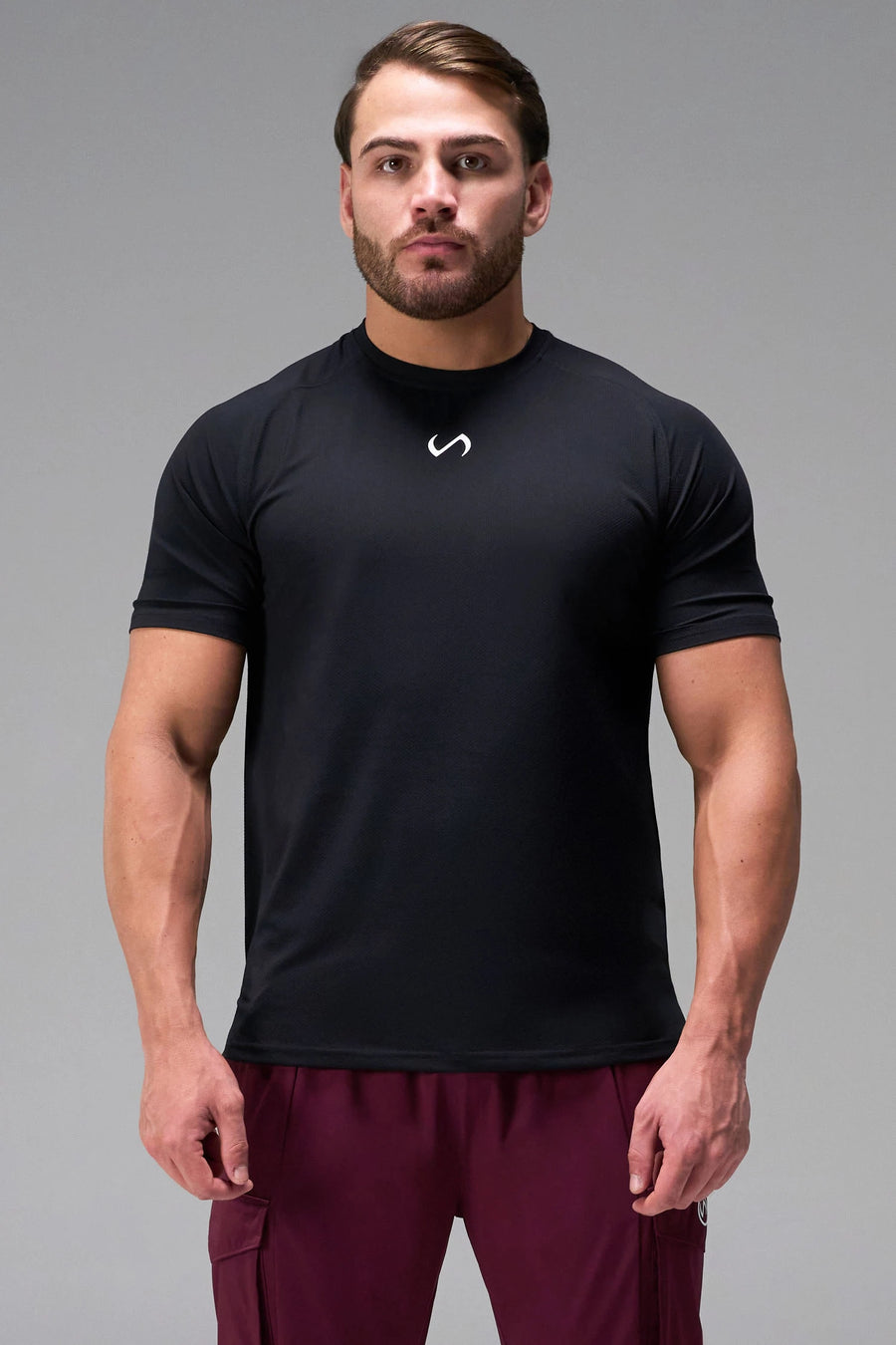 Black Men’s Micro Mesh Tee with a physique-enhancing fit, designed for gym training, HIIT workouts and running by TLF Apparel – front view