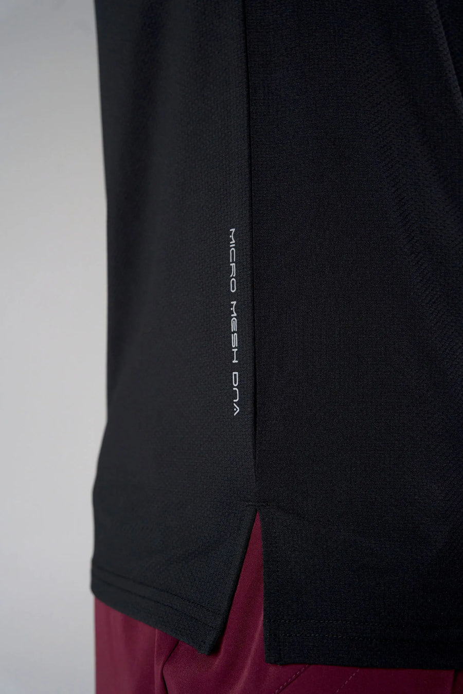 Black Men’s Micro Mesh Tee with a physique-enhancing fit, designed for gym training, HIIT workouts and running by TLF Apparel – side view 