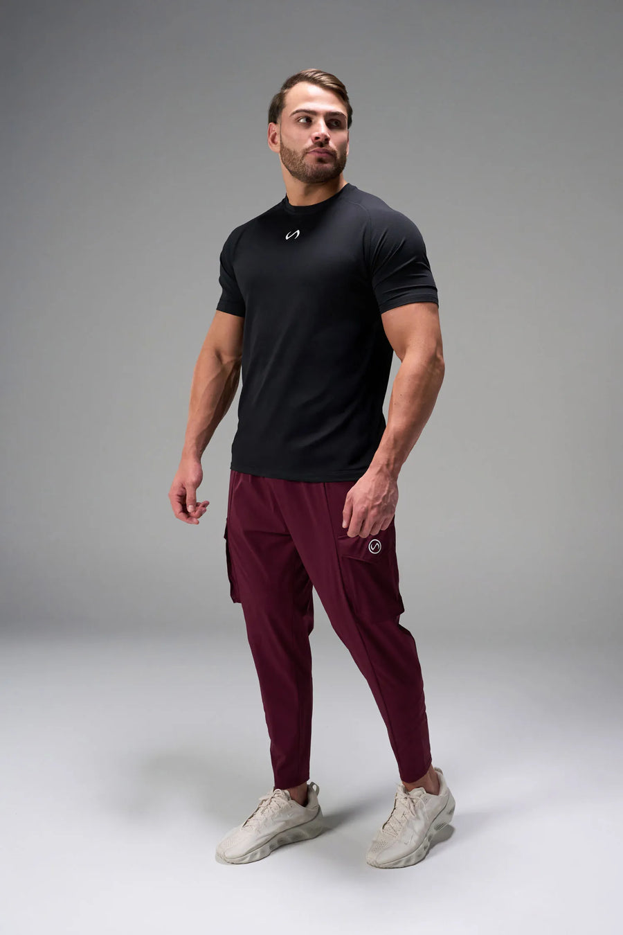 Black Men’s Micro Mesh Tee with a physique-enhancing fit, designed for gym training, HIIT workouts and running by TLF Apparel – front view 