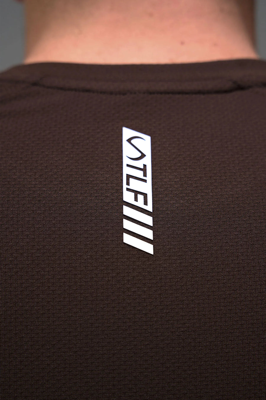Brown Men’s Micro Mesh Tee with a physique-enhancing fit, designed for gym training, HIIT workouts and running by TLF Apparel – back detail view 
