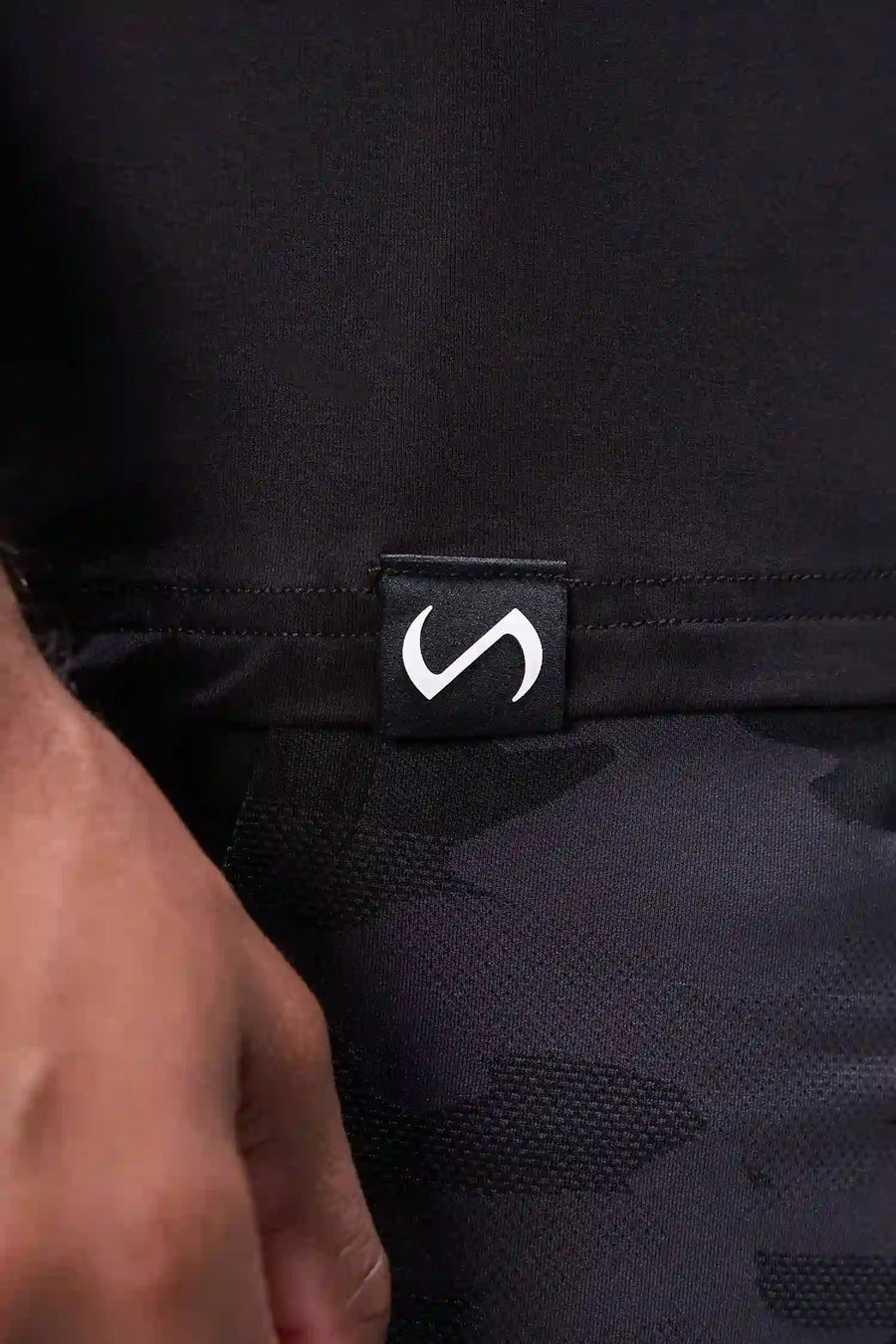Black Bamboo Crew Neck Essential Tee showing ultra soft bamboo fabric texture and silicone icon label detail by TLF Apparel – detail view