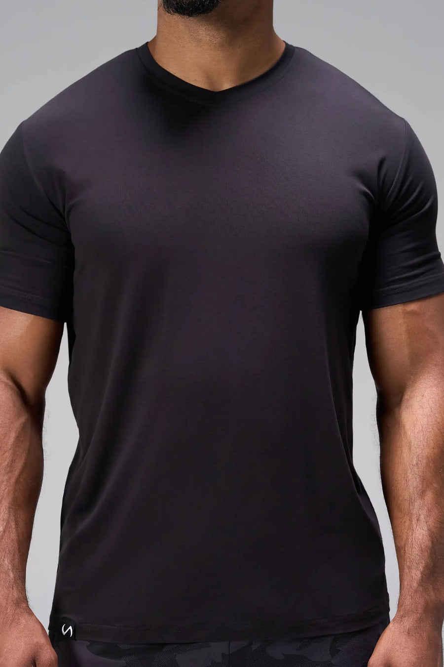 Black Bamboo V Neck Essential Tee showing ultra soft bamboo fabric texture and silicone icon label detail by TLF Apparel – detail view