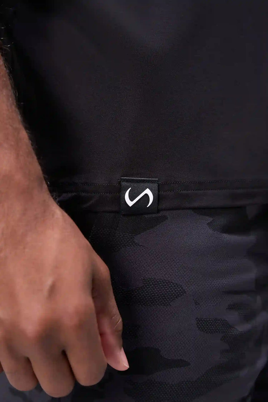 Black Bamboo V Neck Essential Tee showing ultra soft bamboo fabric texture and silicone icon label detail by TLF Apparel – detail view