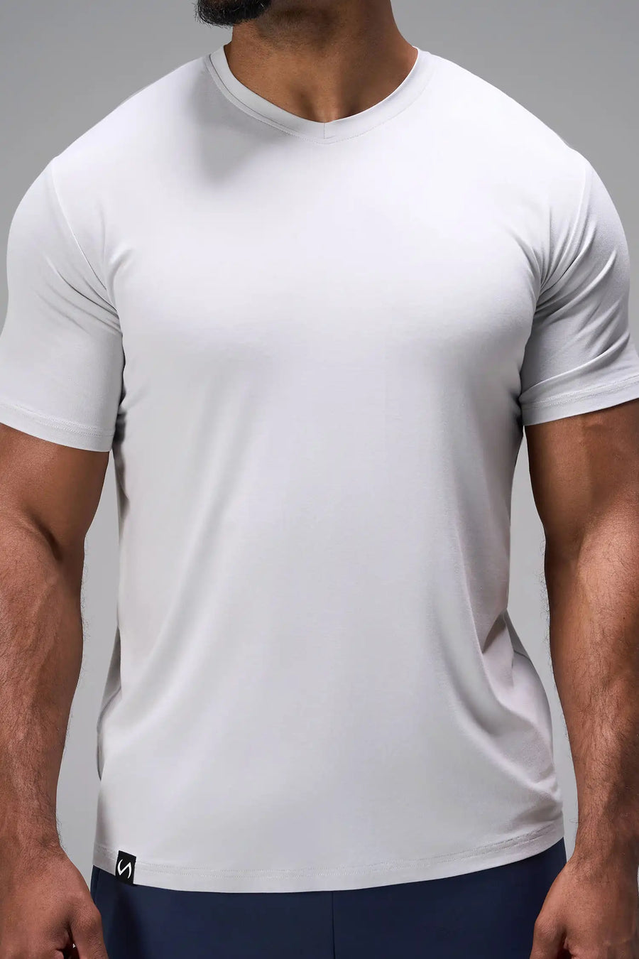 Gray Bamboo V Neck Essential Tee showing ultra soft bamboo fabric texture and silicone icon label detail by TLF Apparel – detail view
