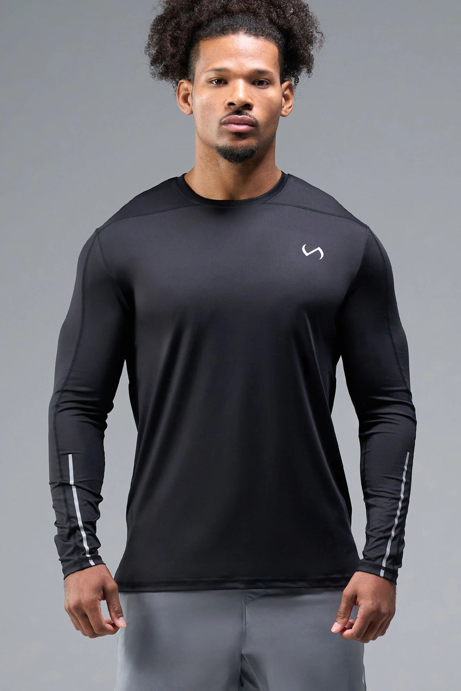 Front View of Black TLF Train Infi-Dry Long Sleeve, featuring our Infi-Dry fabric technology and reflective sleeve design for night running