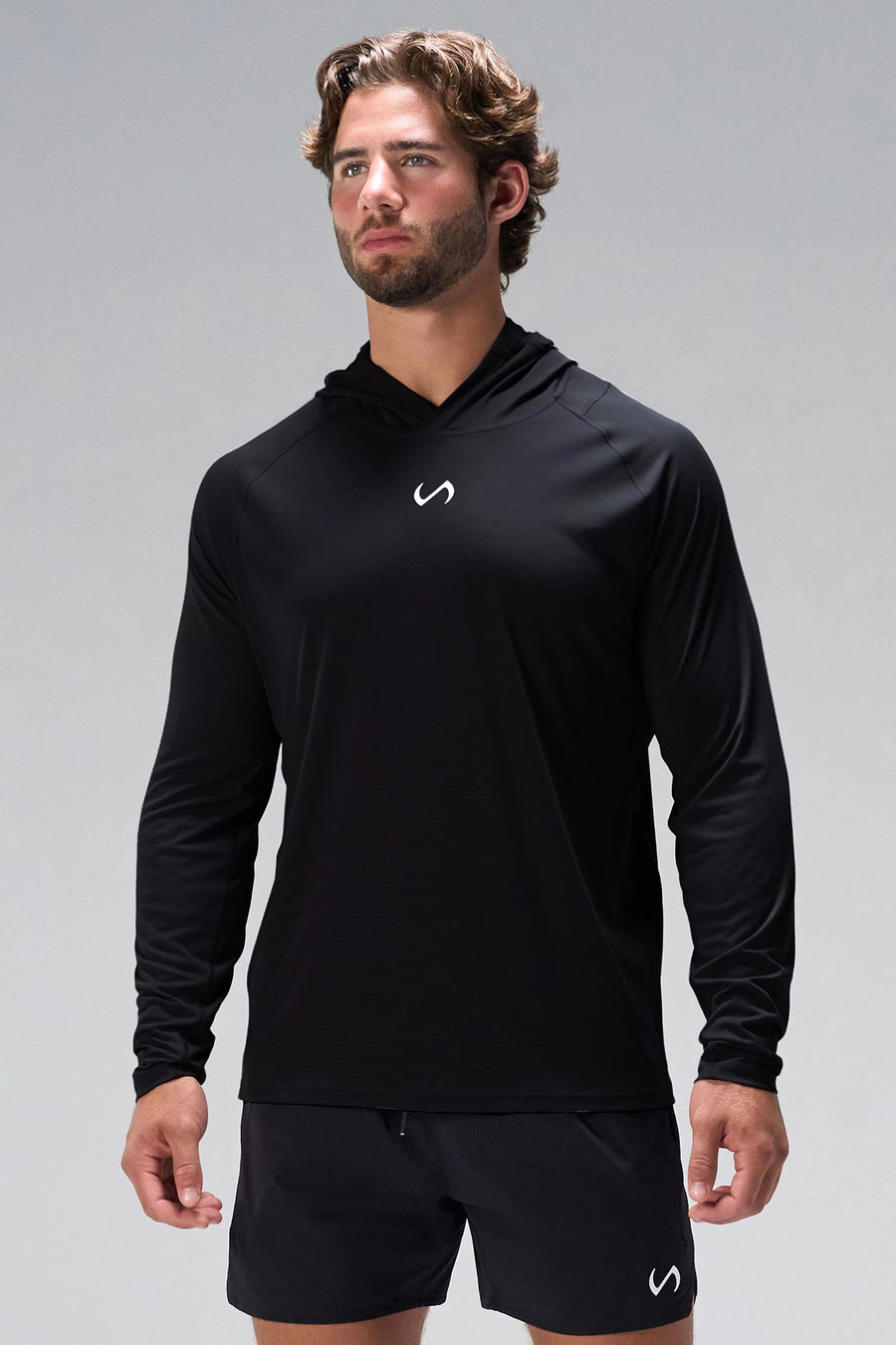 Black Pluma UPF Sun Hoodie showing raglan sleeves, side panels, and athletic fit by TLF Apparel – side view
