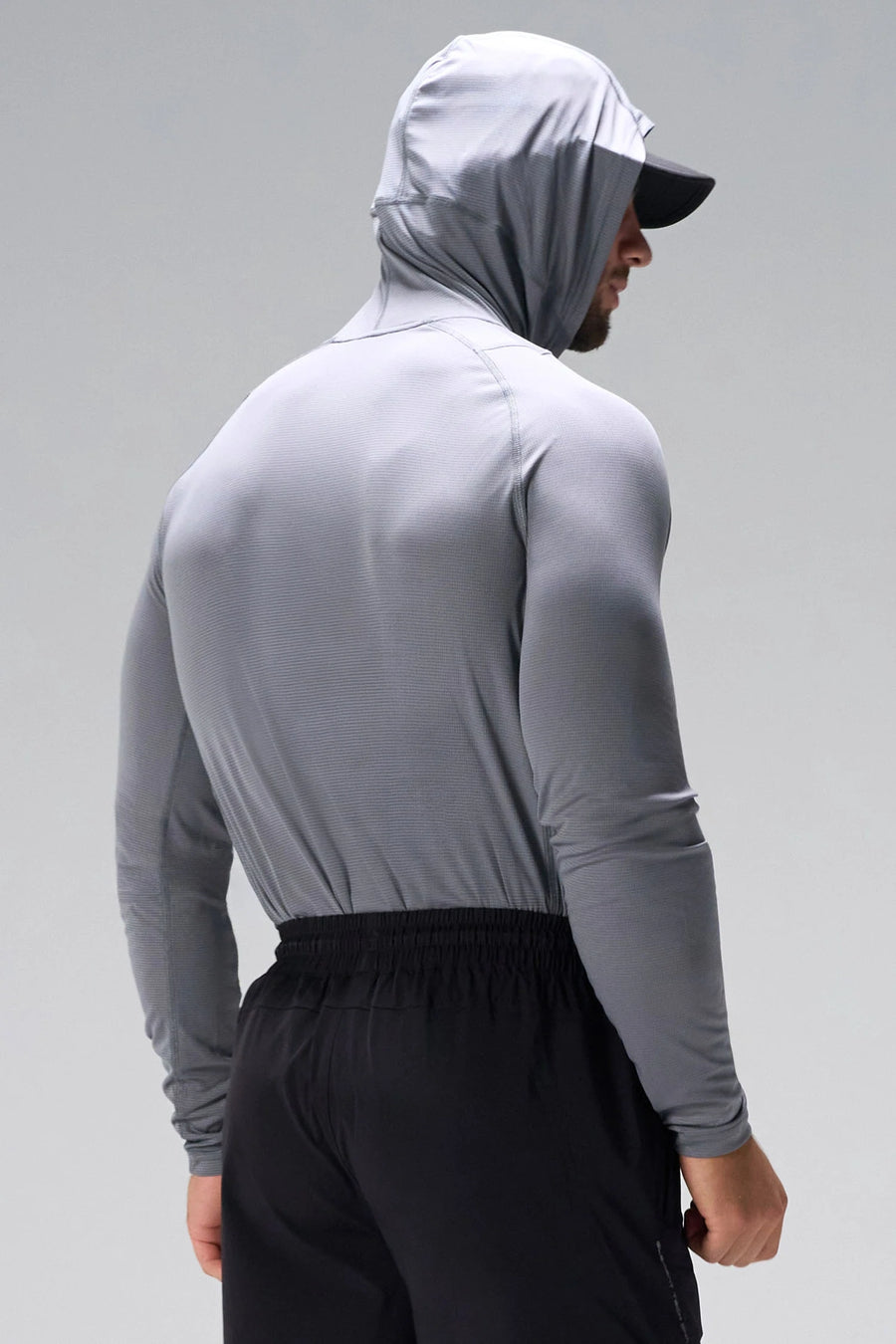 Gray Pluma UPF Sun Hoodie showing 5-panel hood and back hem logo on breathable fabric by TLF Apparel – back view