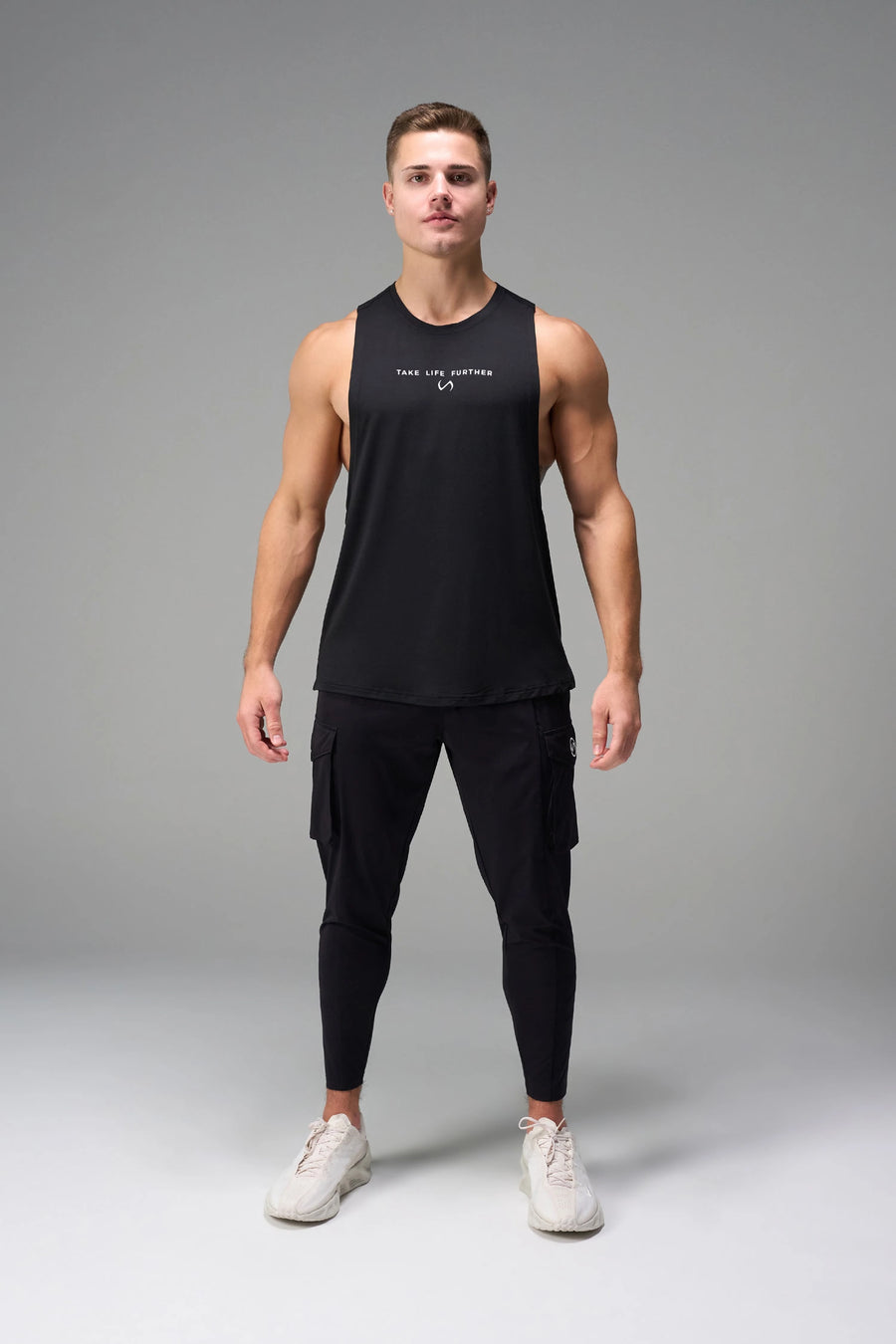 Black Further Air-Flex Drop Arm Tank breathable performance tank designed for training and Gym-To-Street® wear by TLF Apparel – front view