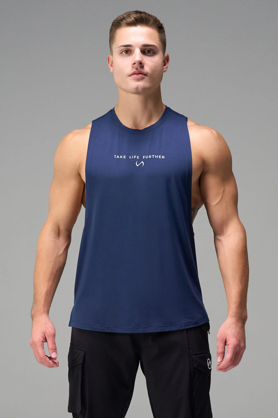 Blue Further Air-Flex Drop Arm Tank made with lightweight Air-Flex DNA™ fabric and athletic performance fit for training and everyday wear by TLF Apparel – front view