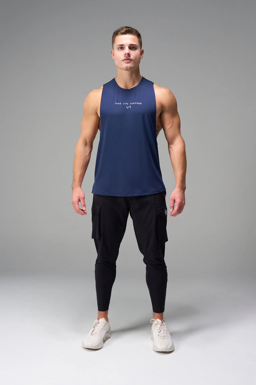Blue Further Air-Flex Drop Arm Tank breathable performance tank designed for training and Gym-To-Street® wear by TLF Apparel – front view