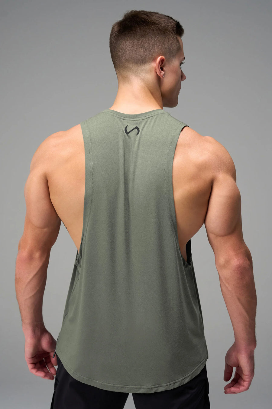 Green Further Air-Flex Drop Arm Tank showing drop arm silhouette and breathable performance fabric by TLF Apparel – side view