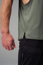 Green Further Air-Flex Drop Arm Tank showing ultra-soft performance fabric and Take Life Further® chest logo detail by TLF Apparel – detail view