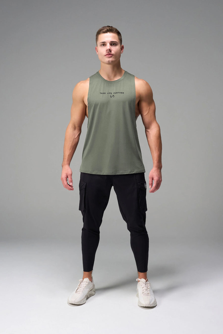 Green Further Air-Flex Drop Arm Tank breathable performance tank designed for training and Gym-To-Street® wear by TLF Apparel – front view