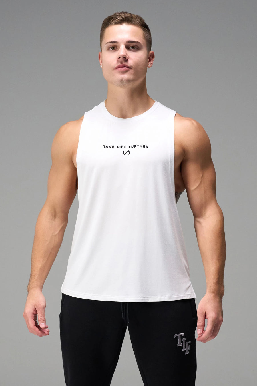 White Further Air-Flex Drop Arm Tank made with lightweight Air-Flex DNA™ fabric and athletic performance fit for training and everyday wear by TLF Apparel – front view