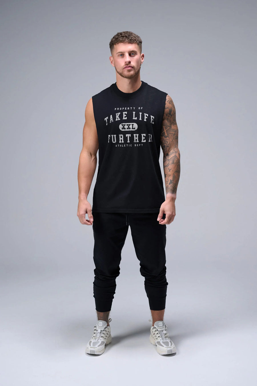 Black Stone Wash Property Of Dura Cotton Muscle Tank with distressed chest graphic, boxy fit and raw edge armholes by TLF Apparel – front view
