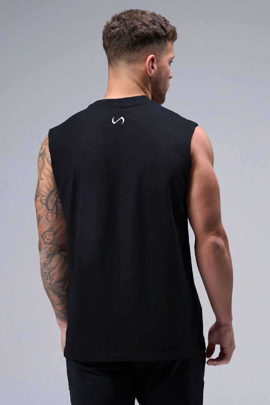 Black Stone Wash Property Of Dura Cotton Muscle Tank showing boxy fit, wide shoulders and heavyweight cotton construction by TLF Apparel – back view