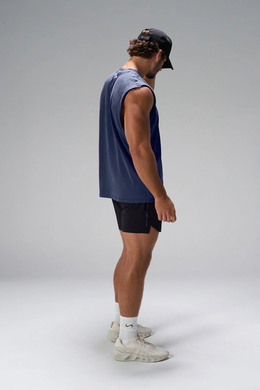  Deep Navy Stone Wash Property Of Dura Cotton Muscle Tank showing boxy streetwear fit, raw edge armholes and heavyweight cotton by TLF Apparel – side view