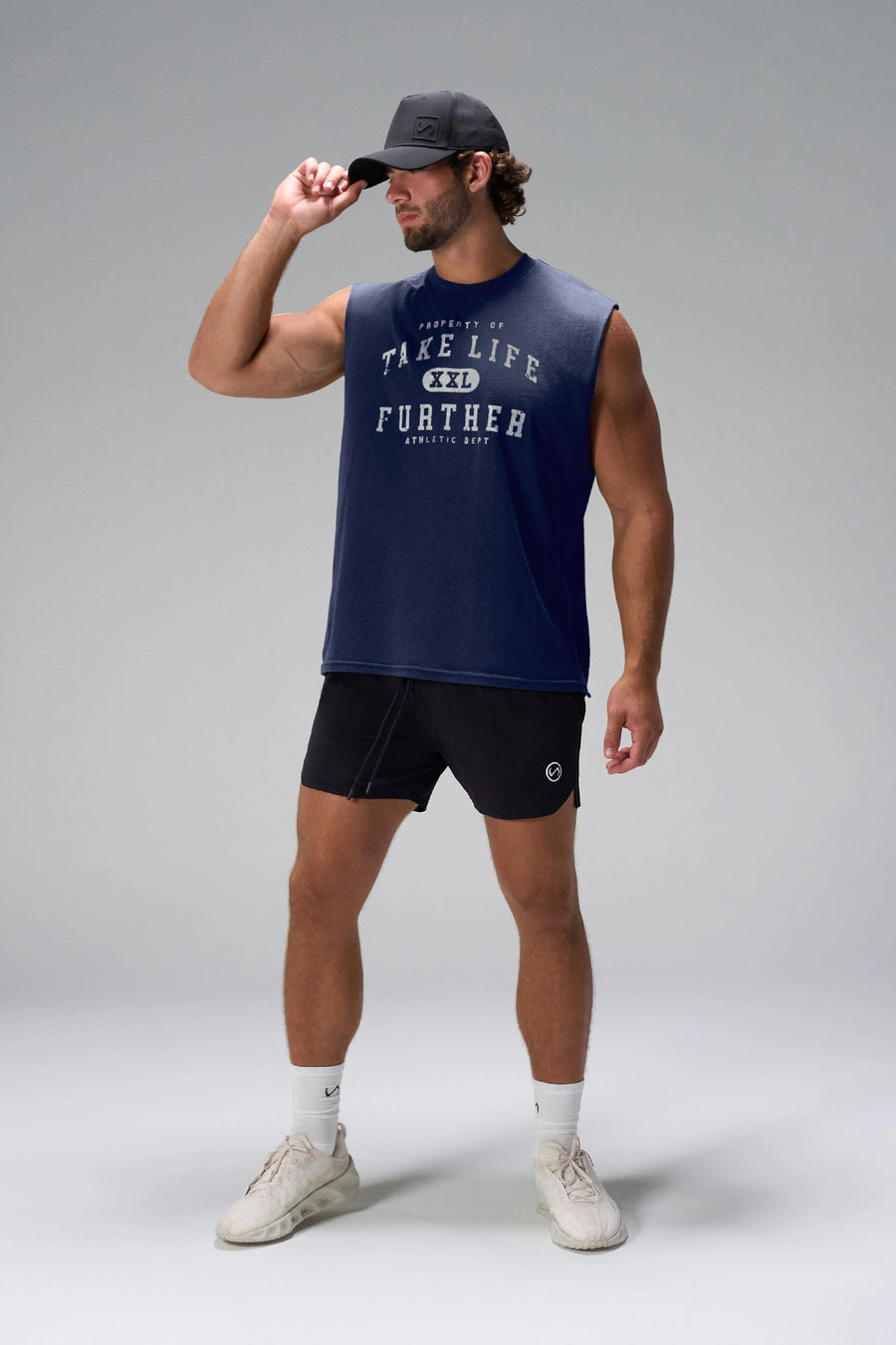 Deep Navy Stone Wash Property Of Dura Cotton Muscle Tank with distressed chest graphic, boxy fit and raw edge armholes by TLF Apparel – front view