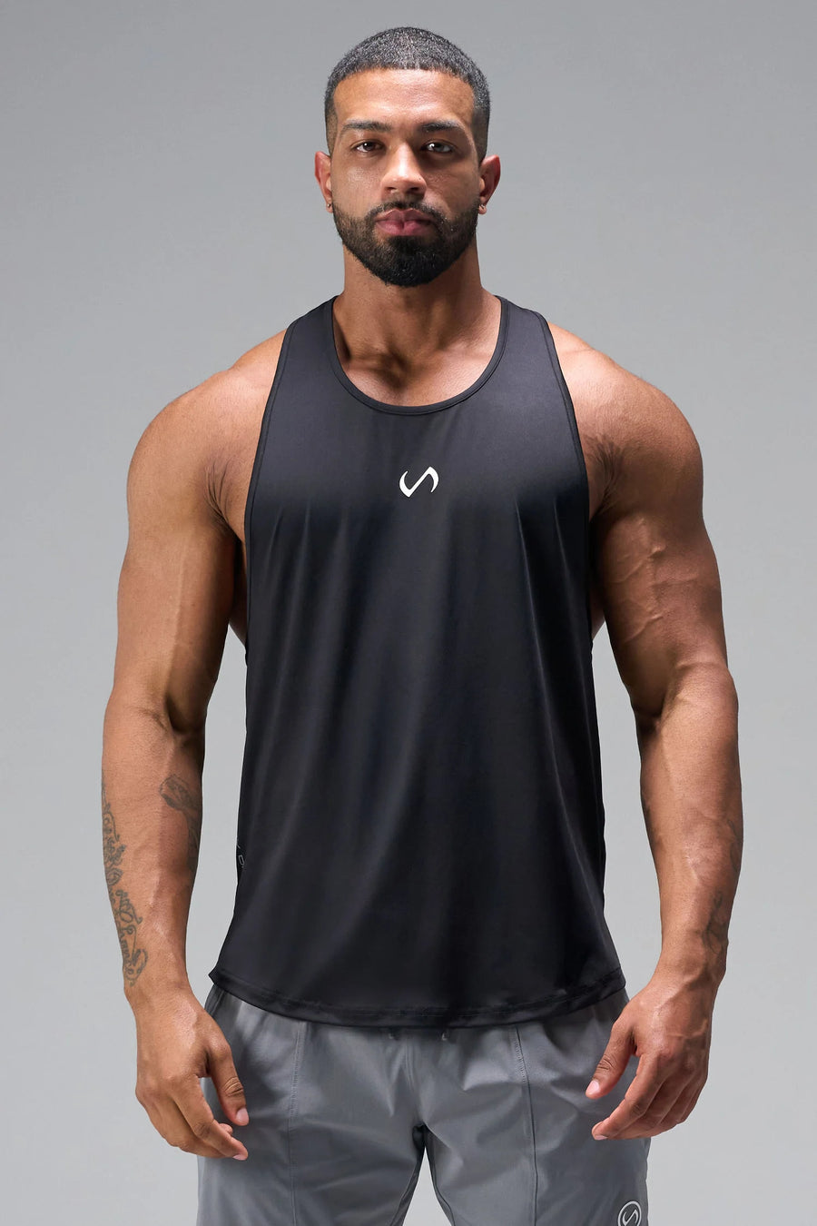 Front View of Black TLF Infi Dry Stringer Tank featuring a physique enhancing design in our advanced Infi-Dry DNA fabric technology