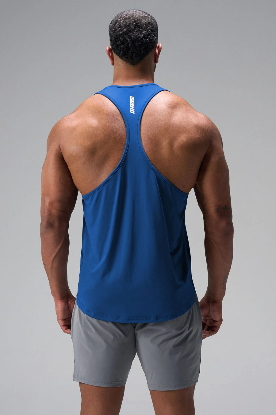 Back View of Blue TLF Infi Dry Stringer Tank featuring a physique enhancing design in our advanced Infi-Dry DNA fabric technology
