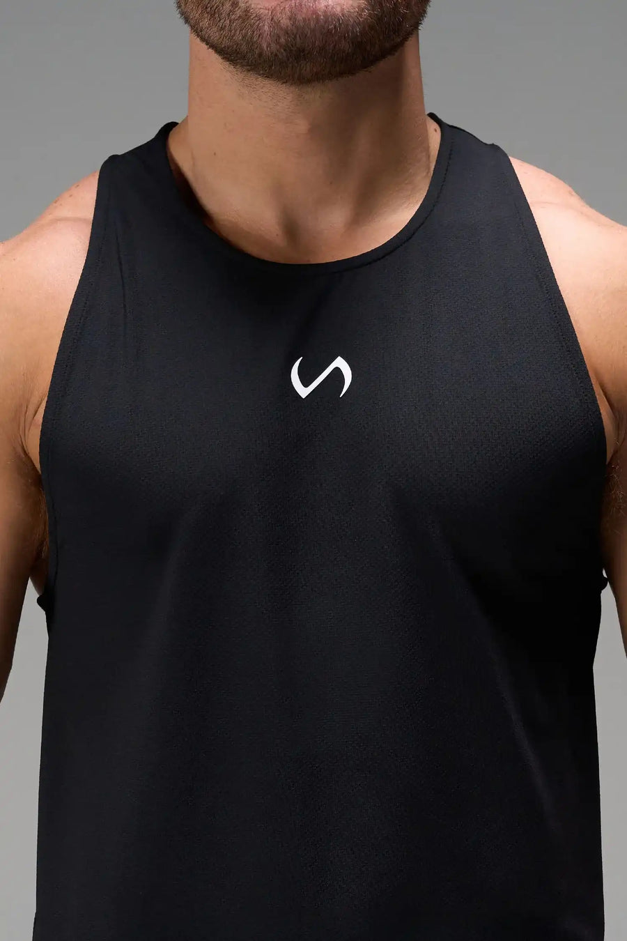 Black Men’s Micro Mesh Tank with a physique-enhancing fit, designed for gym training, HIIT workouts and running by TLF Apparel – detail front view 