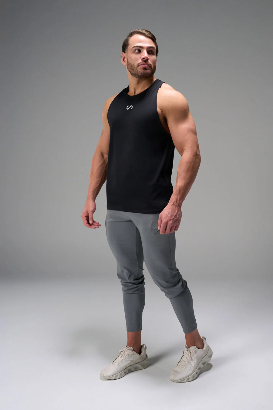 Black Men’s Micro Mesh Tank with a physique-enhancing fit, designed for gym training, HIIT workouts and running by TLF Apparel – front view 