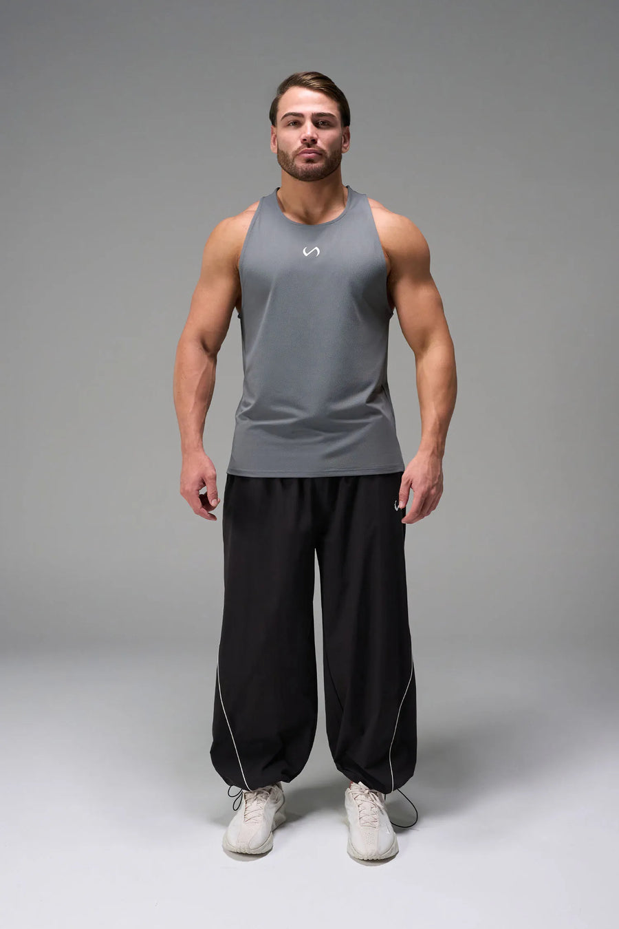 Gray Men’s Micro Mesh Tank with a physique-enhancing fit, designed for gym training, HIIT workouts and running by TLF Apparel – front view 