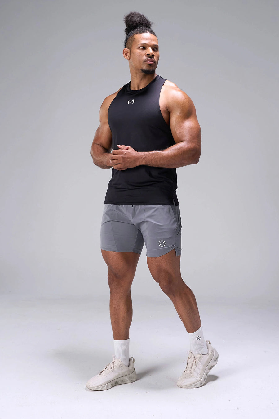 Black Infi-Dry Muscle Tank with moisture-wicking performance fabric, athletic fit, and drop armhole design by TLF Apparel – front angle view