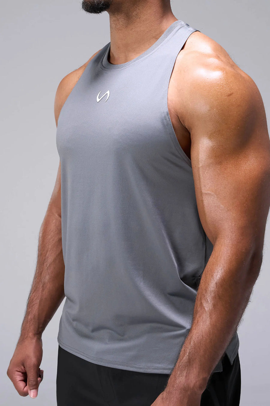 Gray Infi-Dry Muscle Tank with drop armhole construction, athletic fit, and unrestricted mobility for training by TLF Apparel – side view