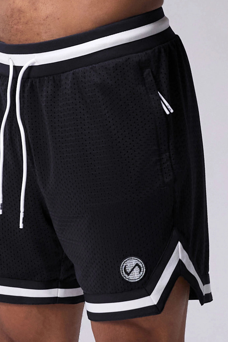 Black TLF Evolve Mesh 6 Inch Shorts showing athletic side silhouette, zip pocket storage, and lightweight mesh fabric by TLF Apparel – side view