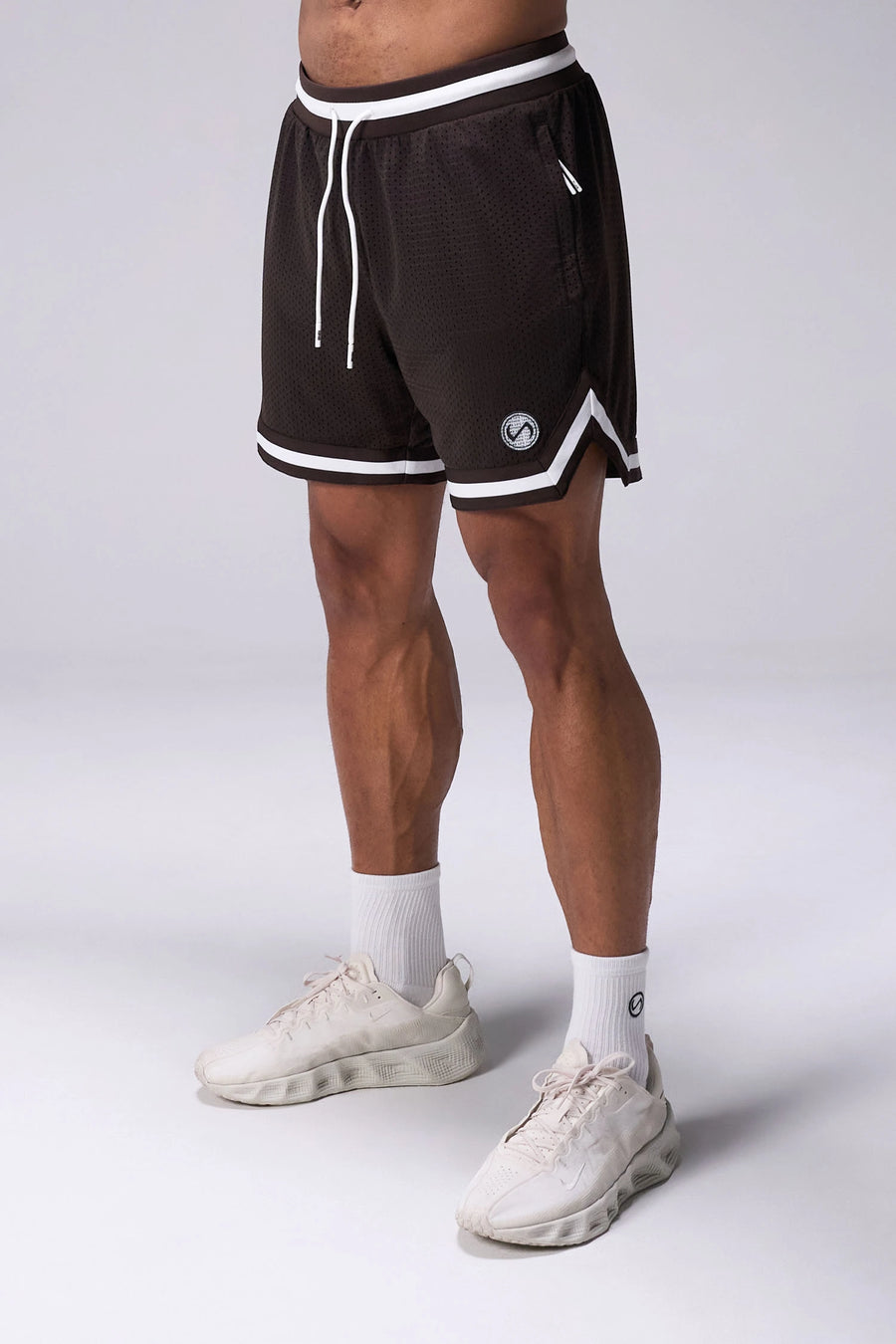 Brown TLF Evolve Mesh 6 Inch Shorts with lightweight breathable mesh fabric, zip pockets, and 4-way stretch performance for gym training and workouts by TLF Apparel – front view